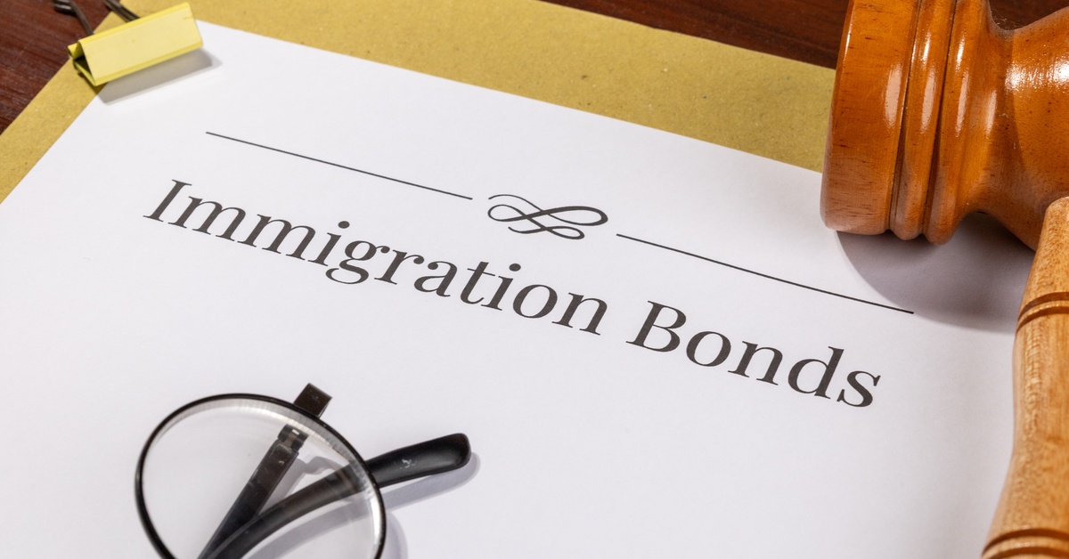 Immigration bonds document on a table with a gavel beside it, representing a bond hearing and legal process.